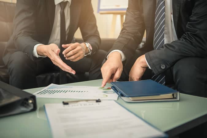 Men negotiating at work