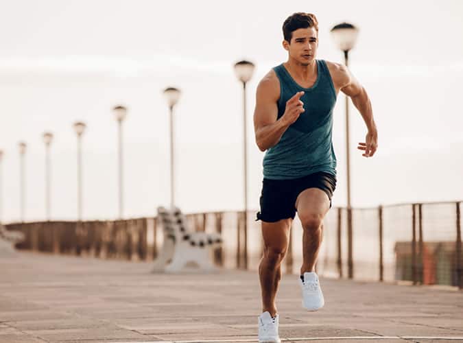 Man sprinting between burpee sets