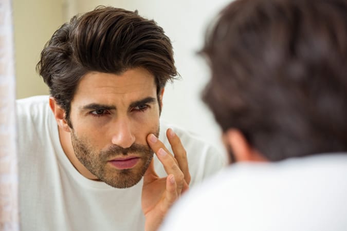 Man looking at stubble