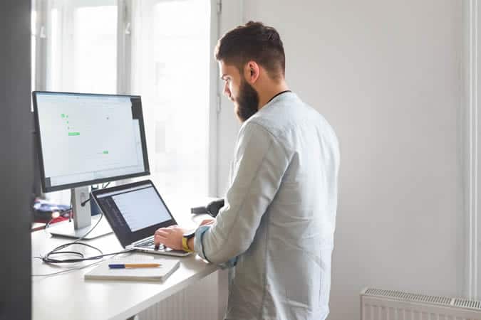 Man working at a standing desk