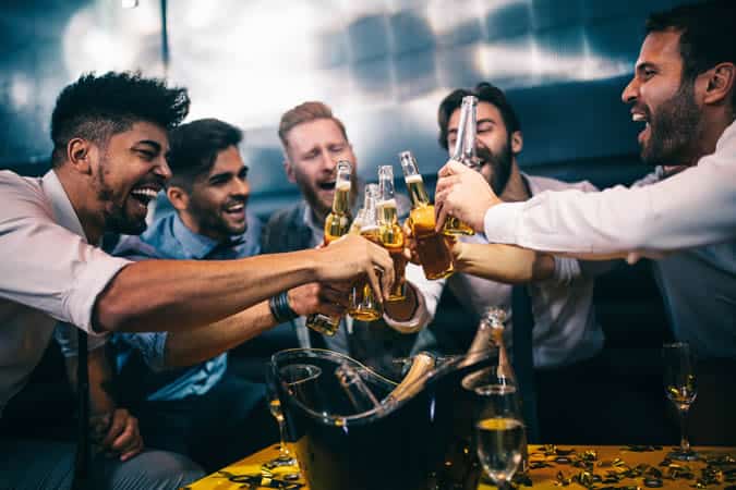 Group of men raising a toast
