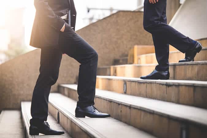 Men walking up and down steps