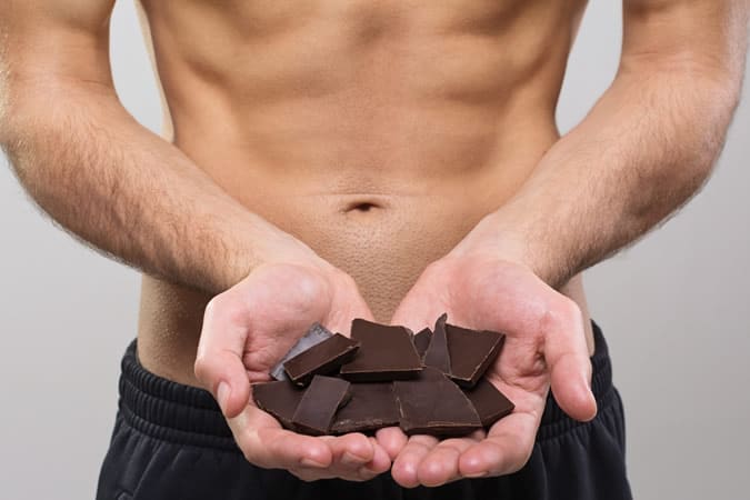 Man Holding Dark Chocolate