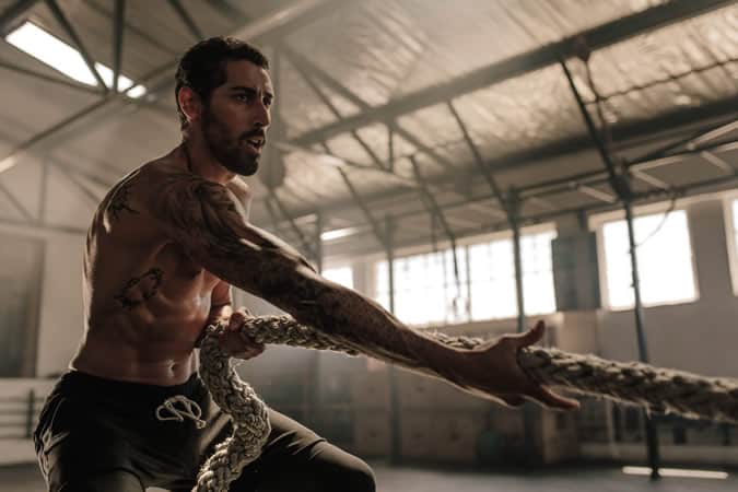 Strong man pulling a rope