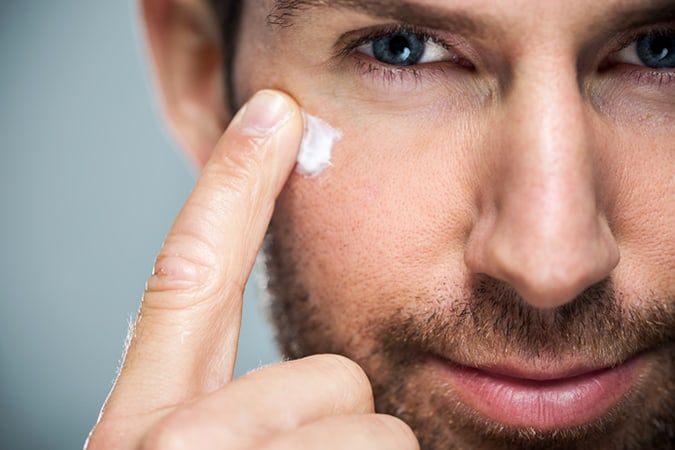 Man applying face cream