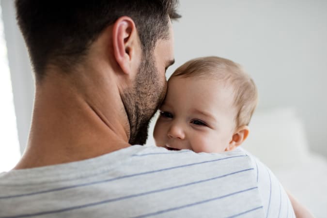 Father holding son