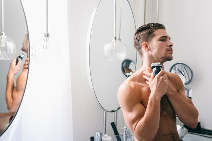 Man Trimming Beard