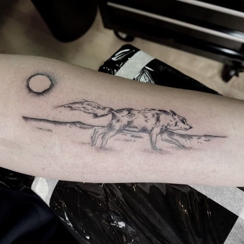 Running wolf tattoo 