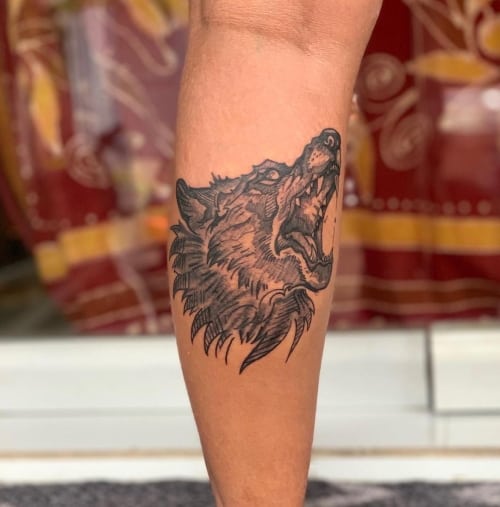 Small wolf tattoo