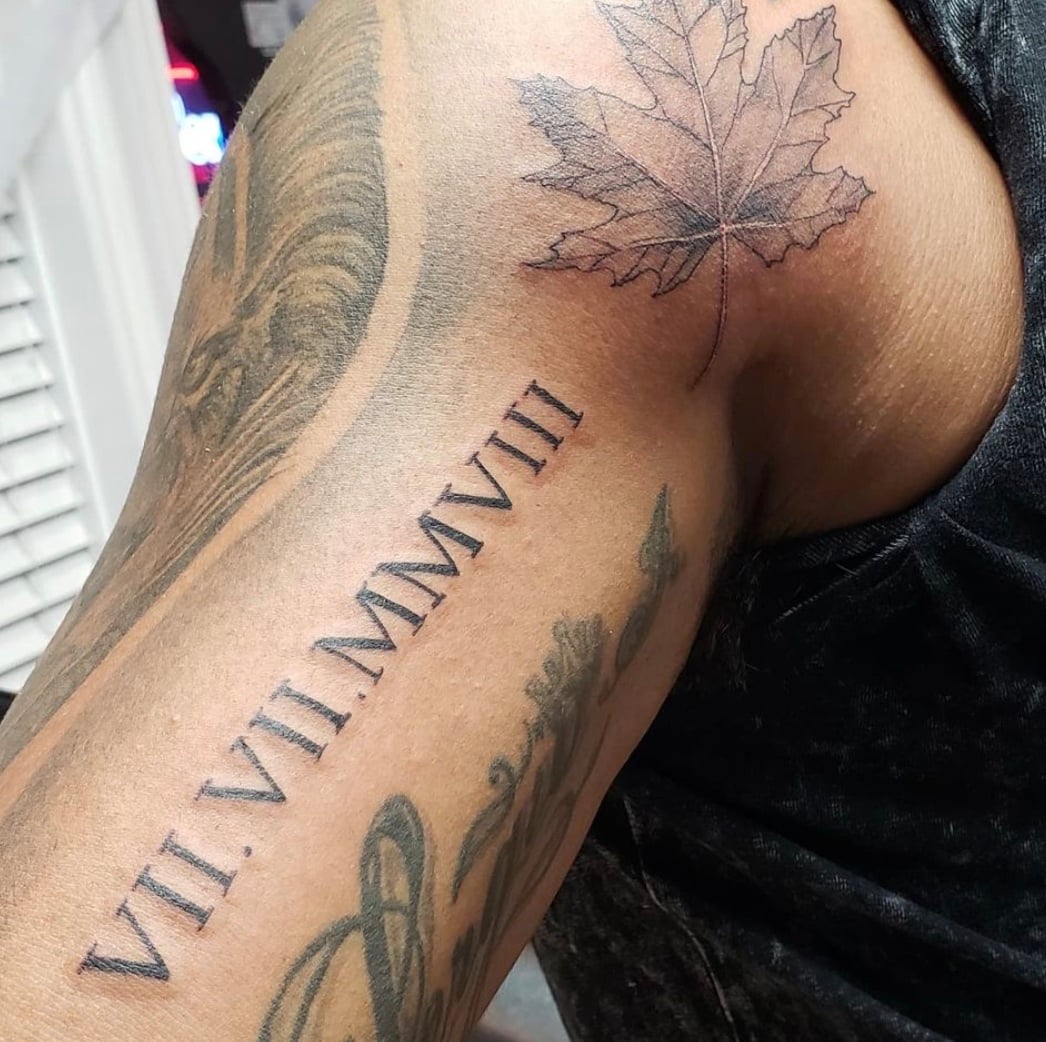 Roman Numeral Tattoo on Bicep 