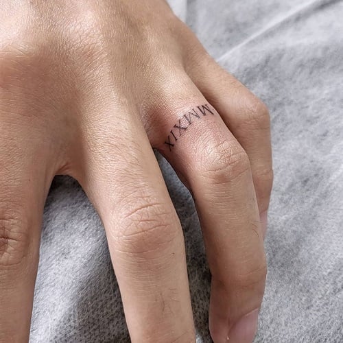 Roman Numeral Ring Tattoo