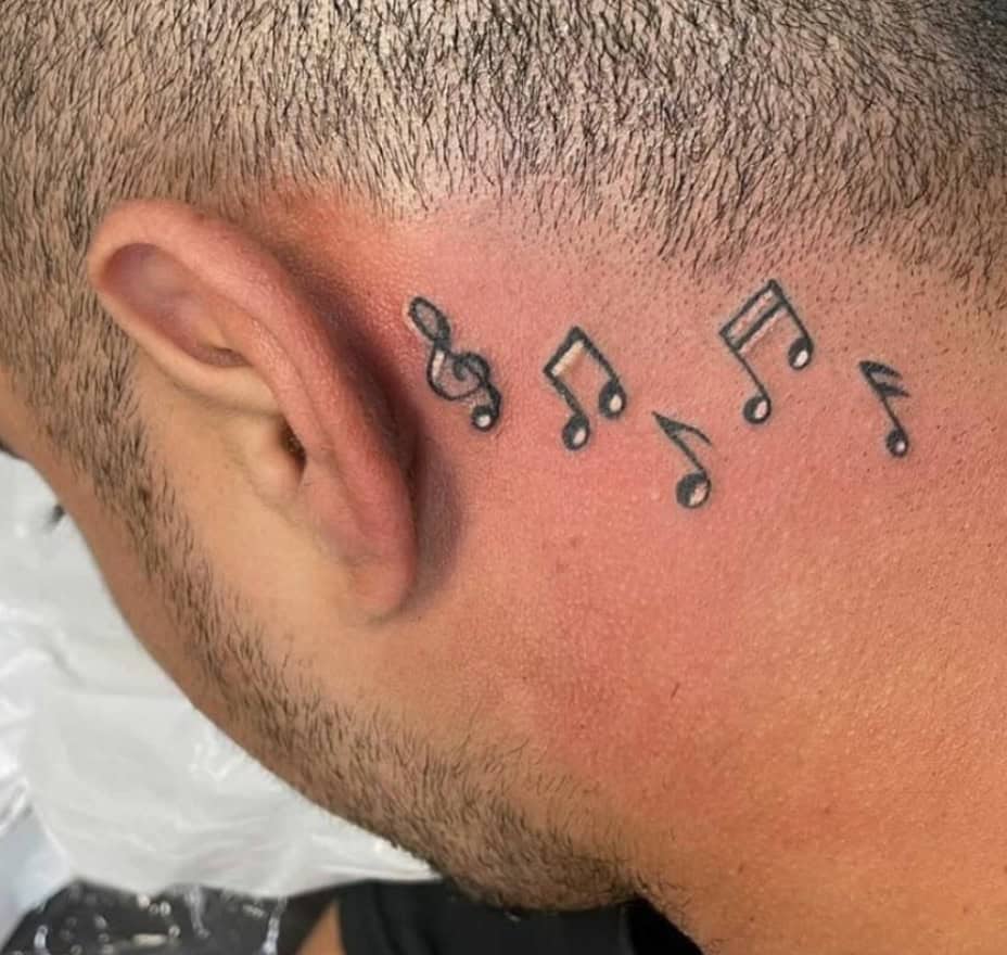 Scattered Music Notes Tattoo