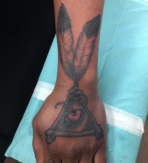 Wrist Feather Tattoo