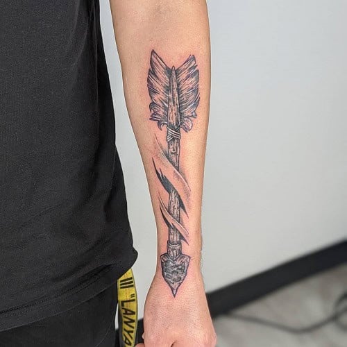 Arrow Through Skin Tattoo