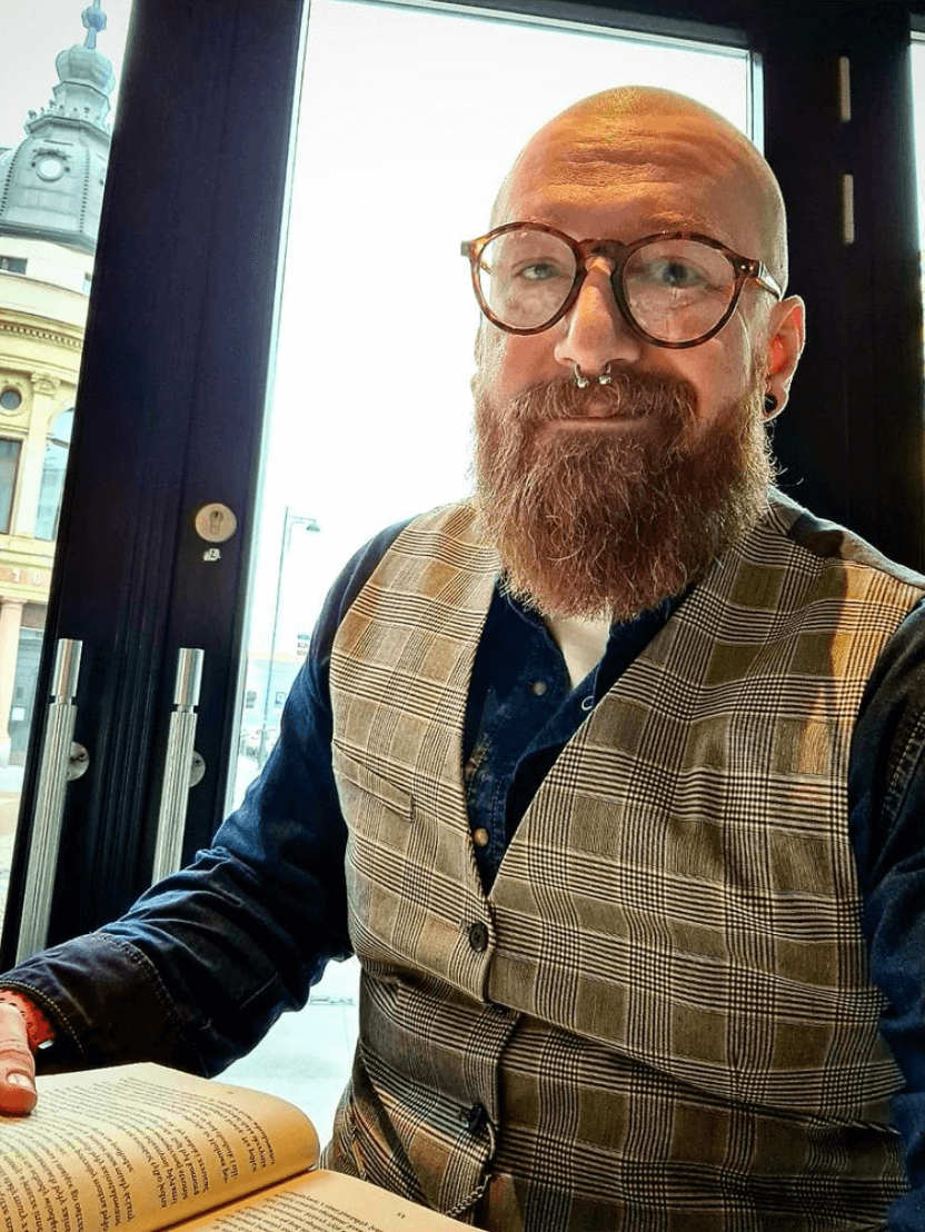 Bald man with round beard