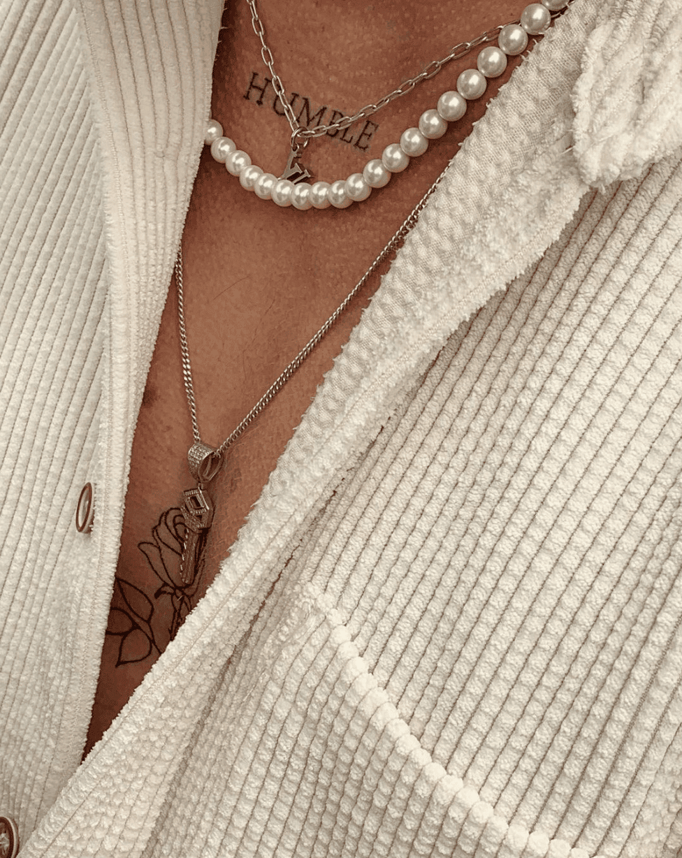 Man wearing pearl necklace