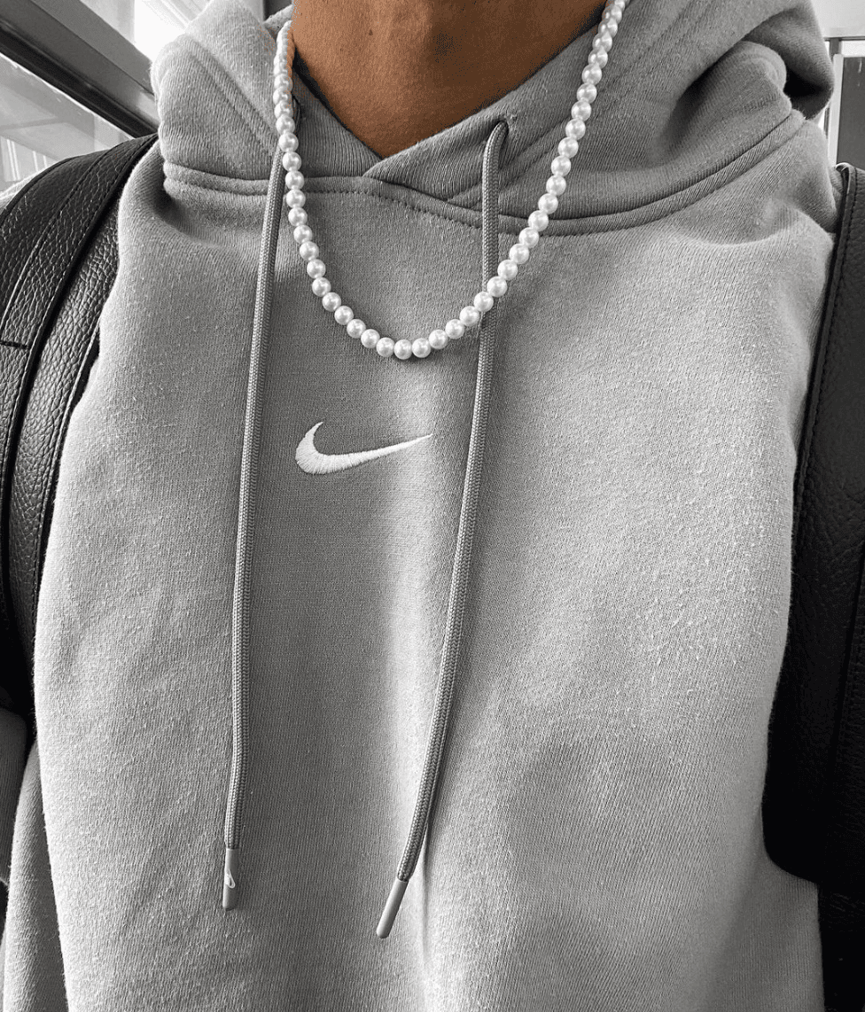 Man wearing a pearl necklace