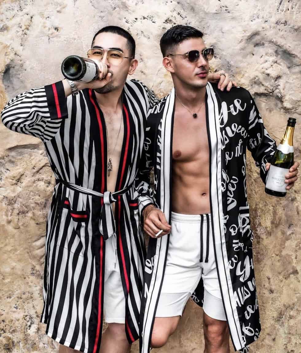 Men wearing robs while drinking Champaign 