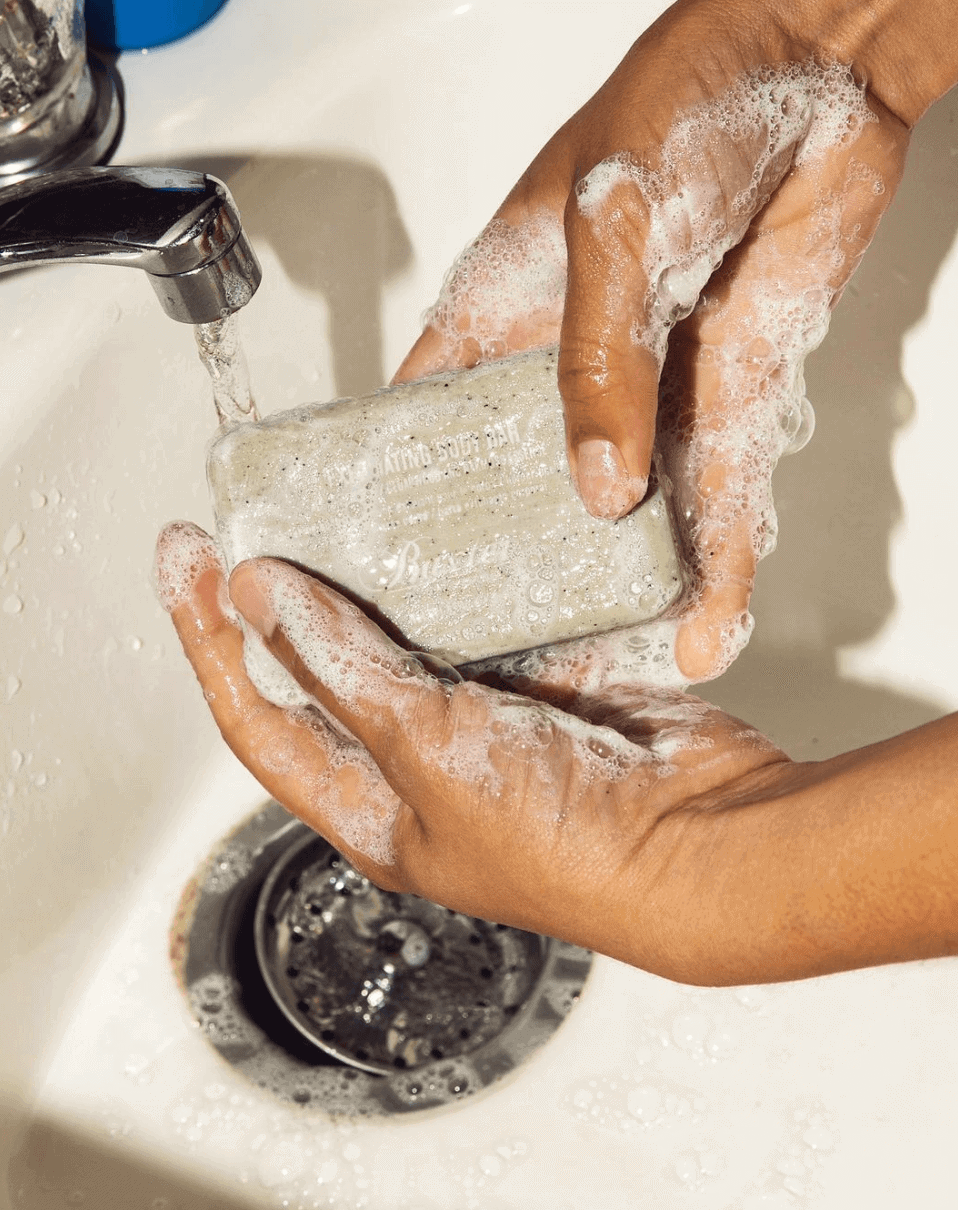 Two hands using the best soap for men
