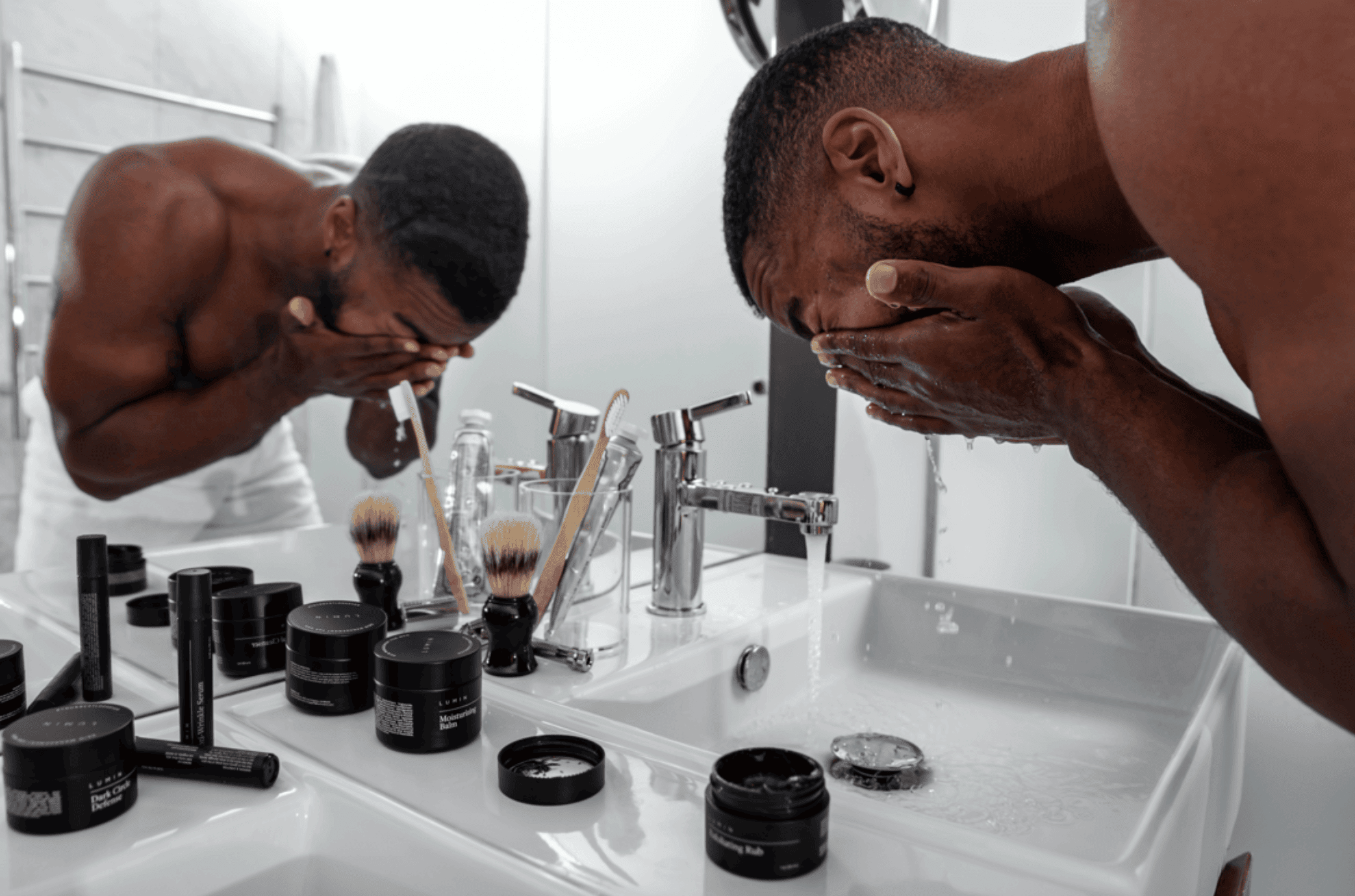 Man washing his face