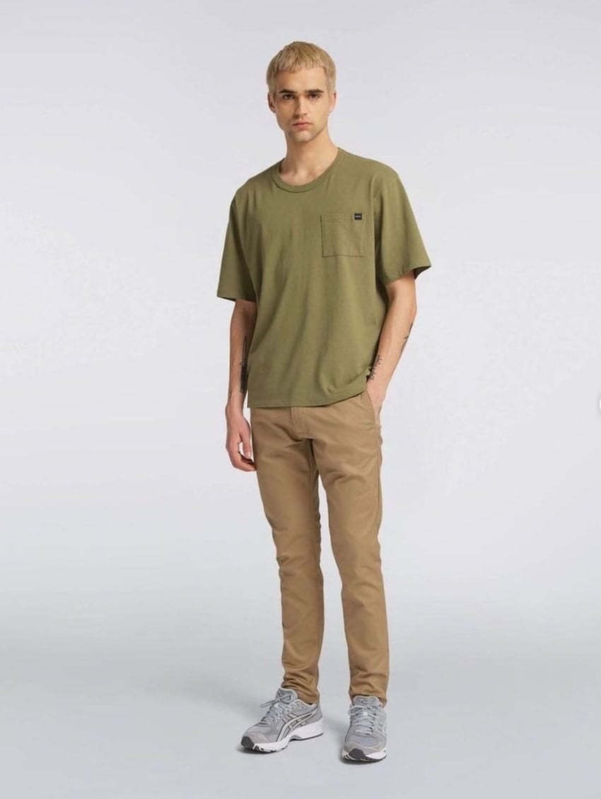 Men's khaki pants and a green shirt on a model