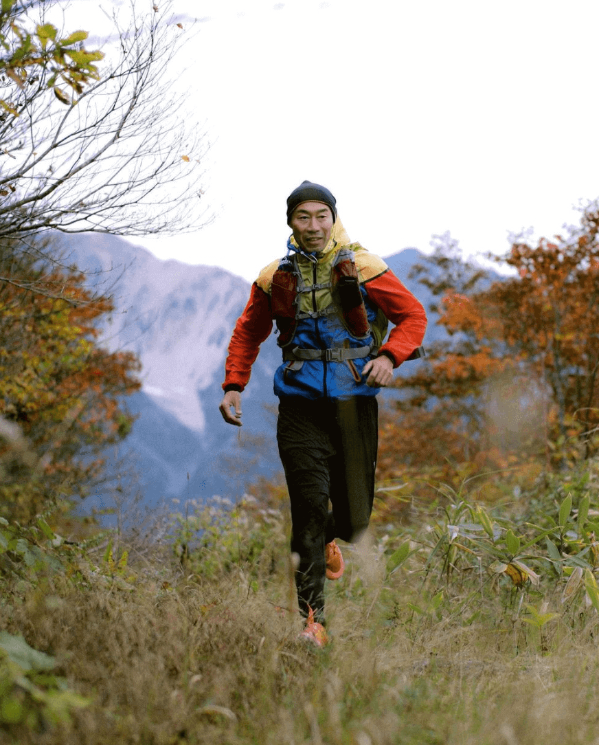 Man running in men's workout pants in the woods