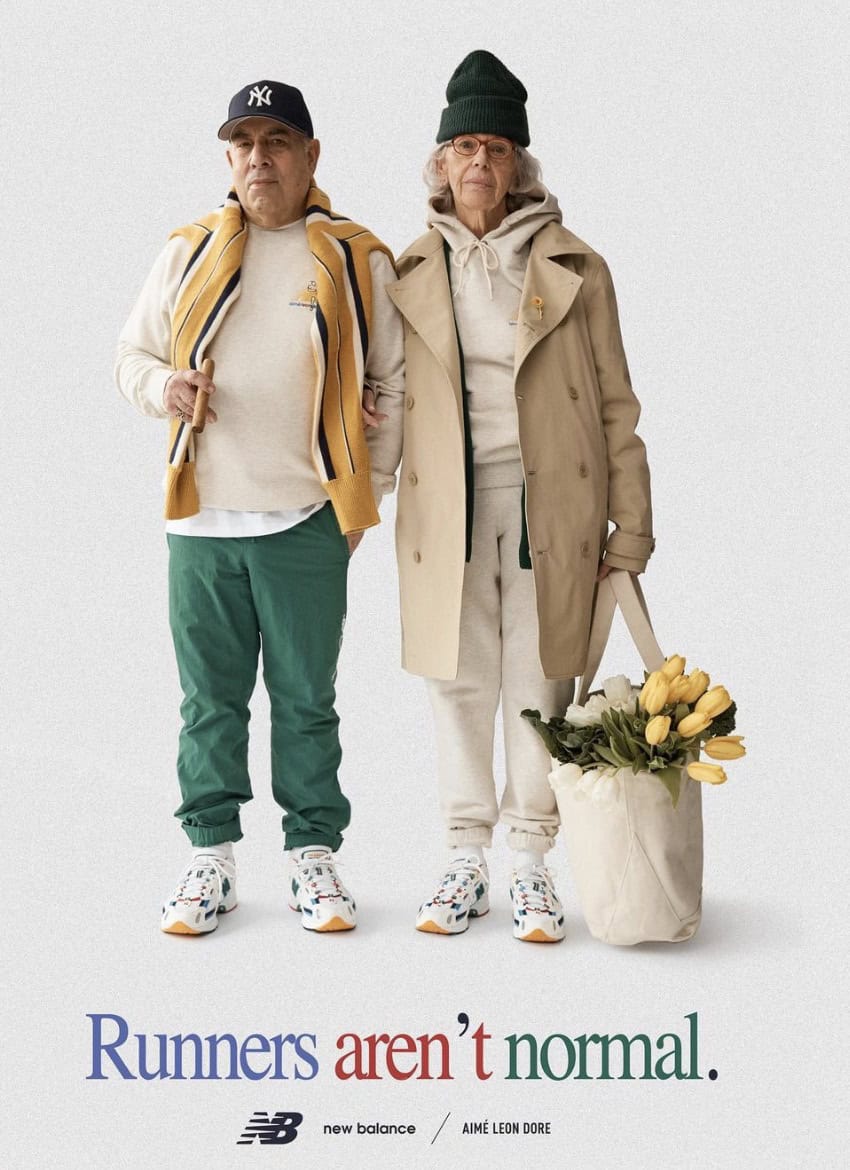Two elderly people in workout or comfort attire one with a large tote bag with yellow tulips
