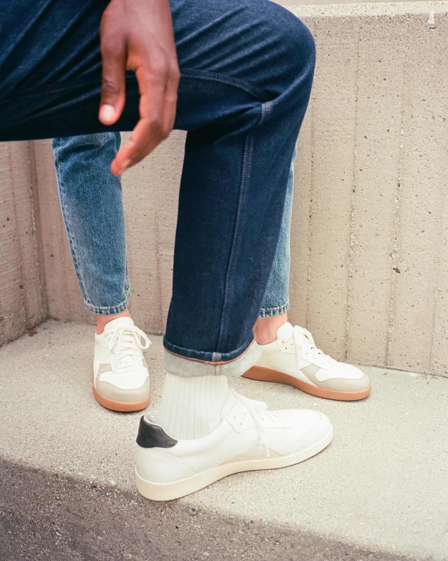 blue jeans on white sneakers