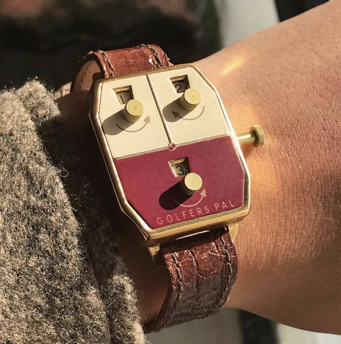 Vintage golf keepers watch on a persons wrist