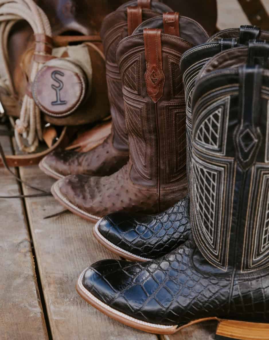 cowboy boots lined up on a poarch