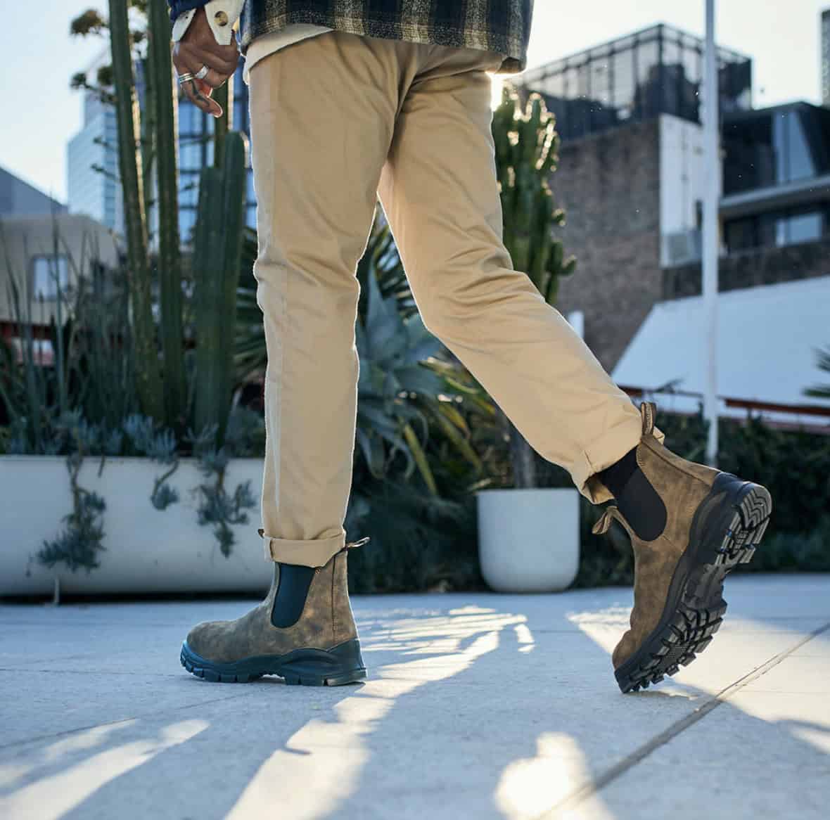 Man walking in blundstones, shot from the waist down
