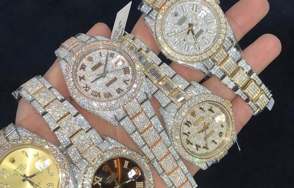 hand with lots of diamond watches on it