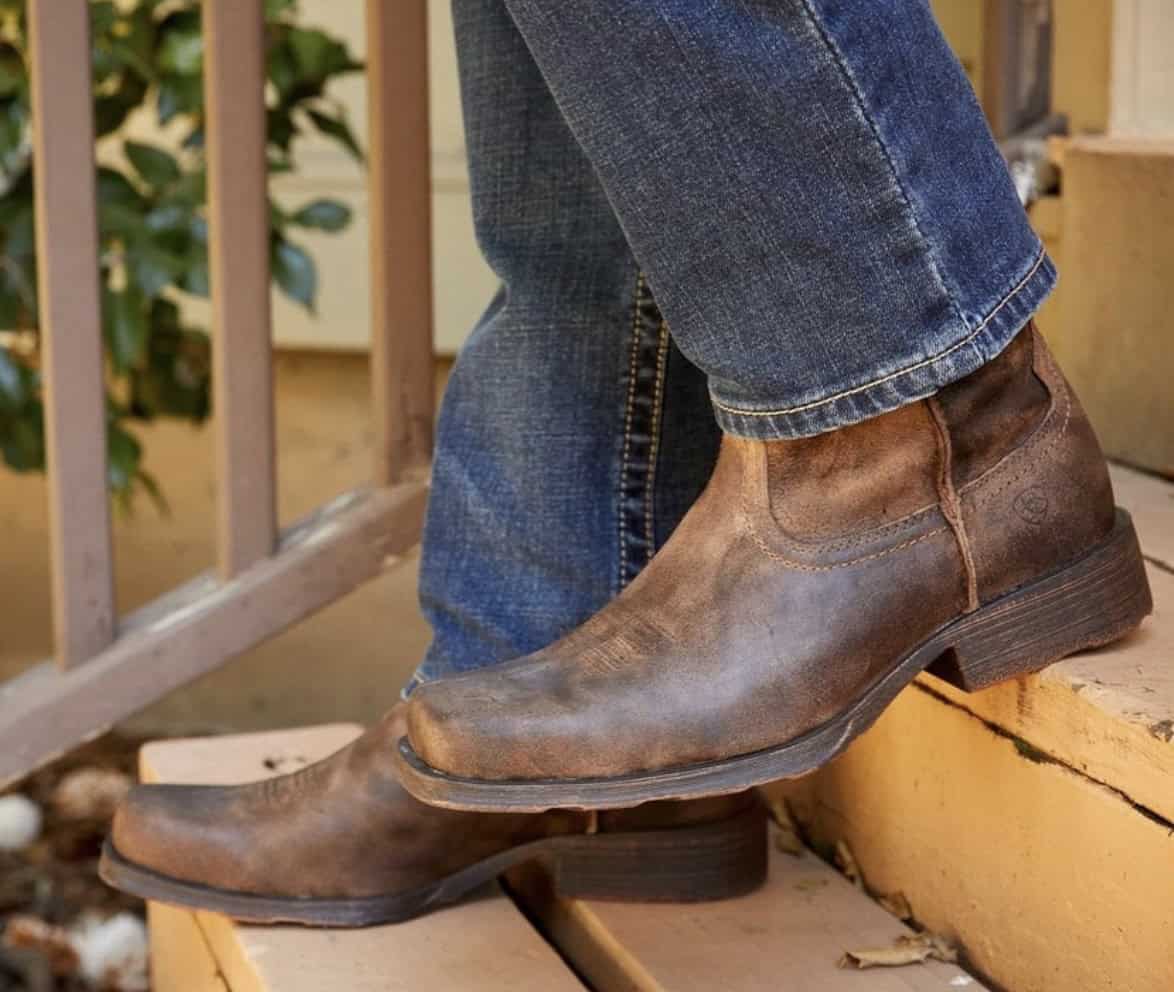 close up of cowboy boots on steps