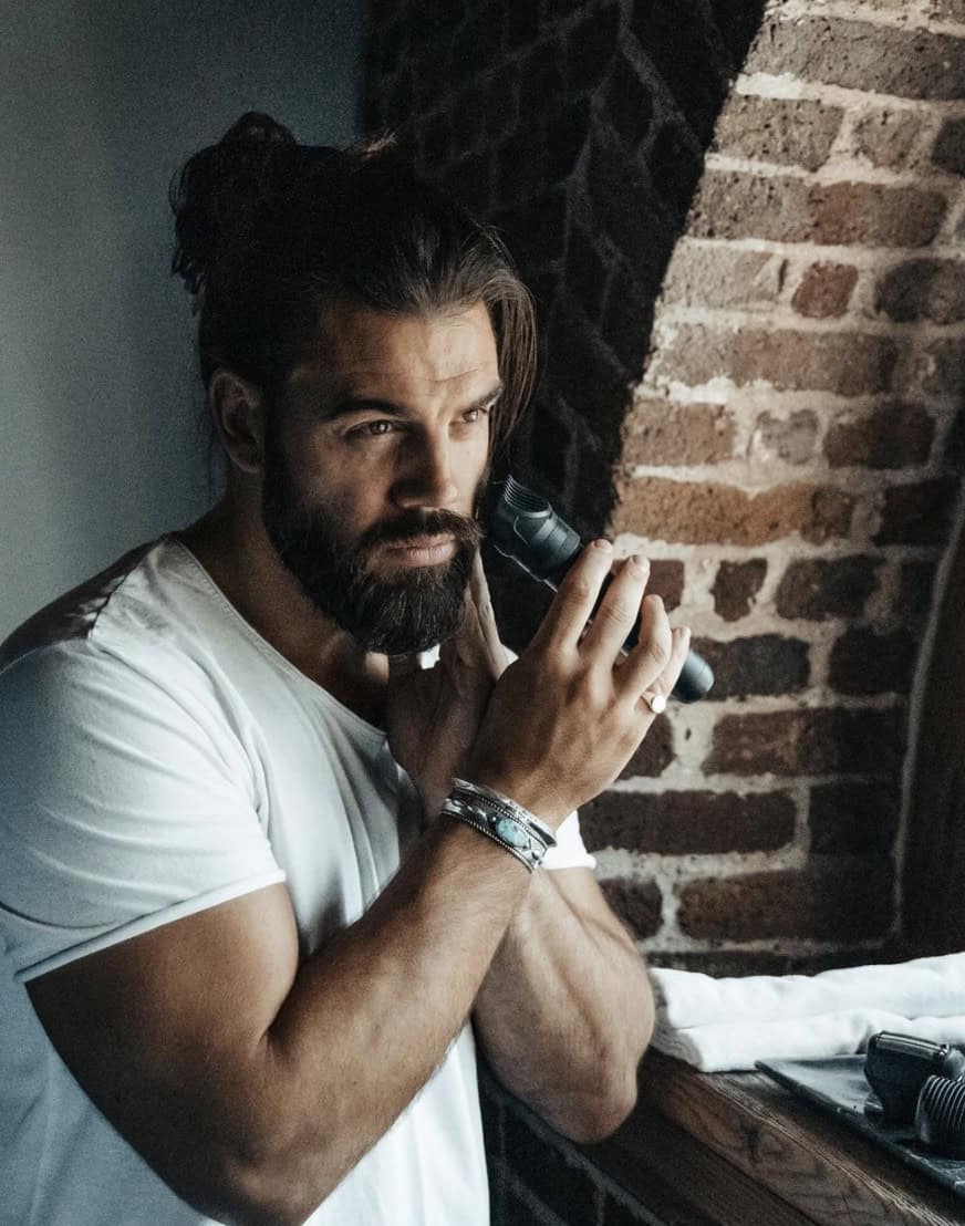 Man grooming beard