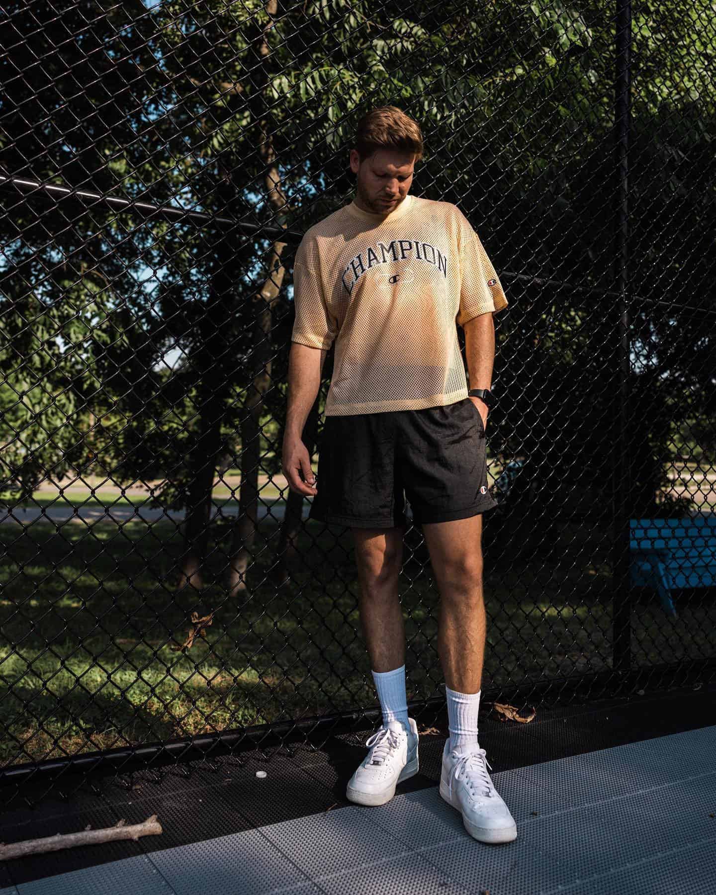 Man wearing a black 5 inch inseam shorts