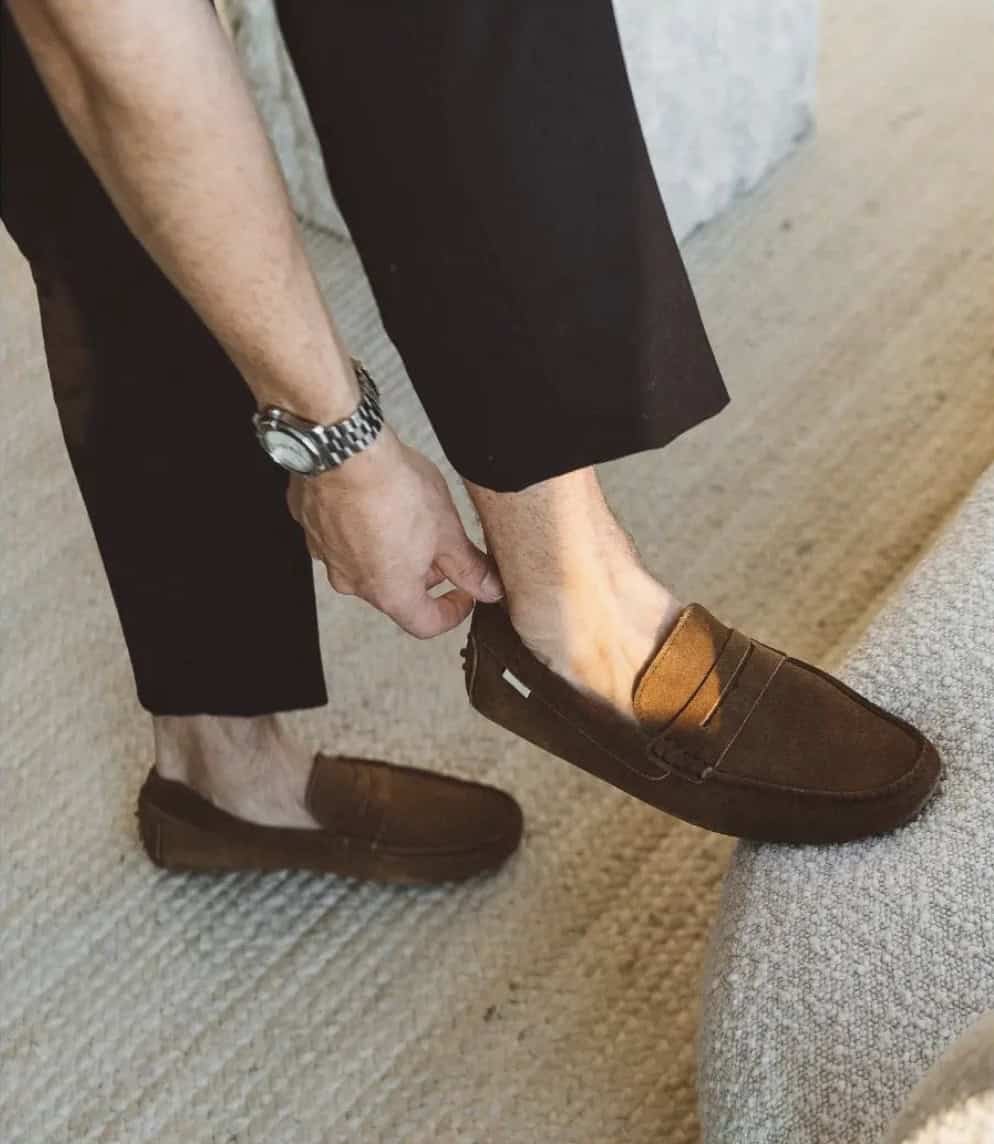 man putting on loafers with no show socks