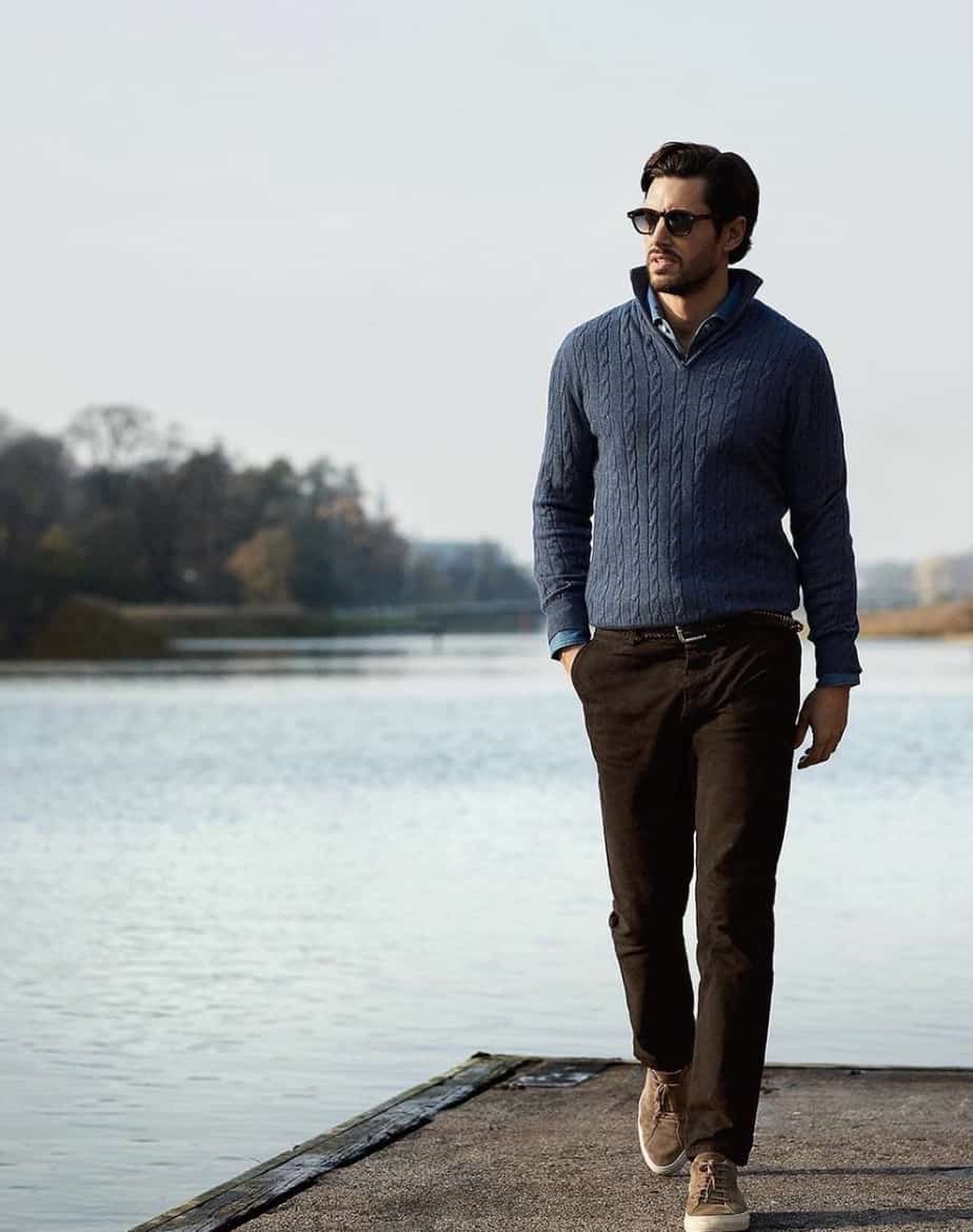 Man walking on a dock on a lake, modeling Luca Faloni Clothes