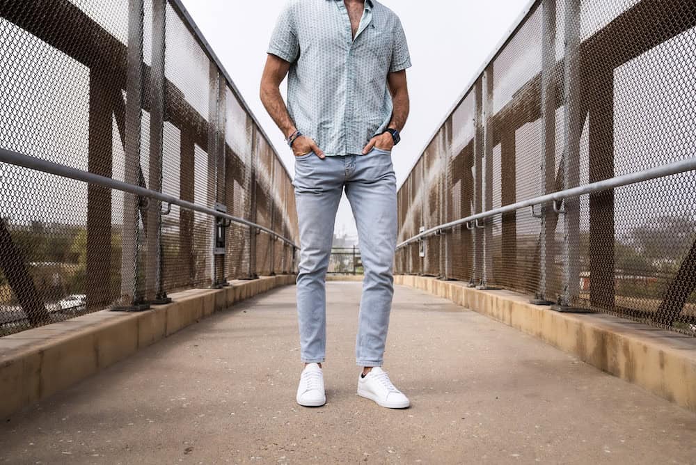 Man standing on a bridge highlighting Oliver Cabell Low 1s