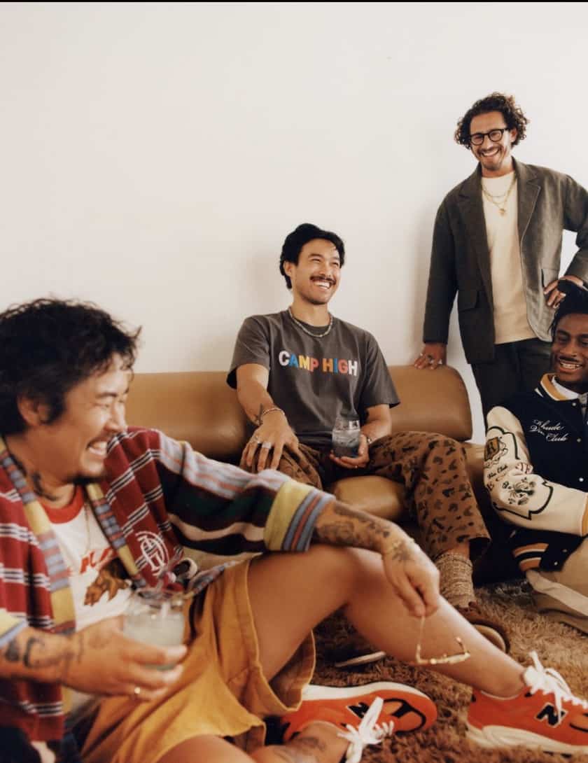 men sitting in a room laughing