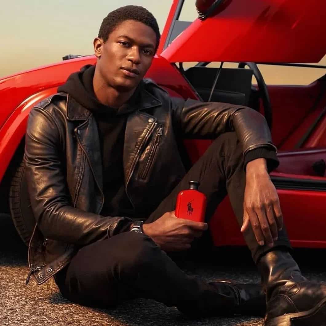 Model holding a bottle of Polo Red