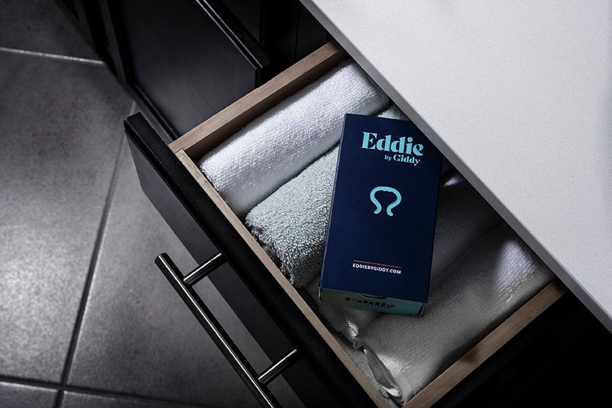 Eddie by Giddy on towels in a drawer