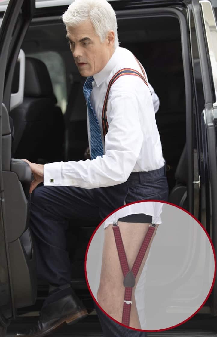 Man getting out of a car, bubble showing underneath his pants he's wearing shirttail garters