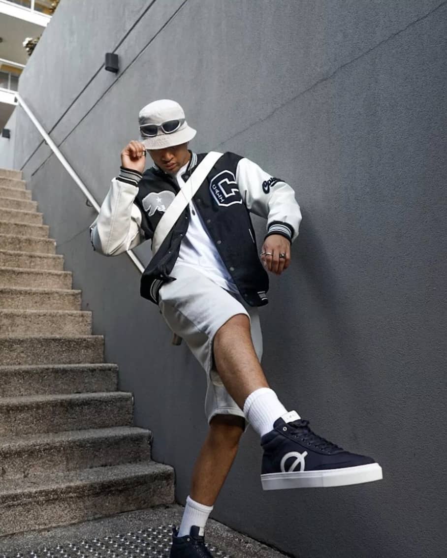man walking down stairs showing of loci shoes 