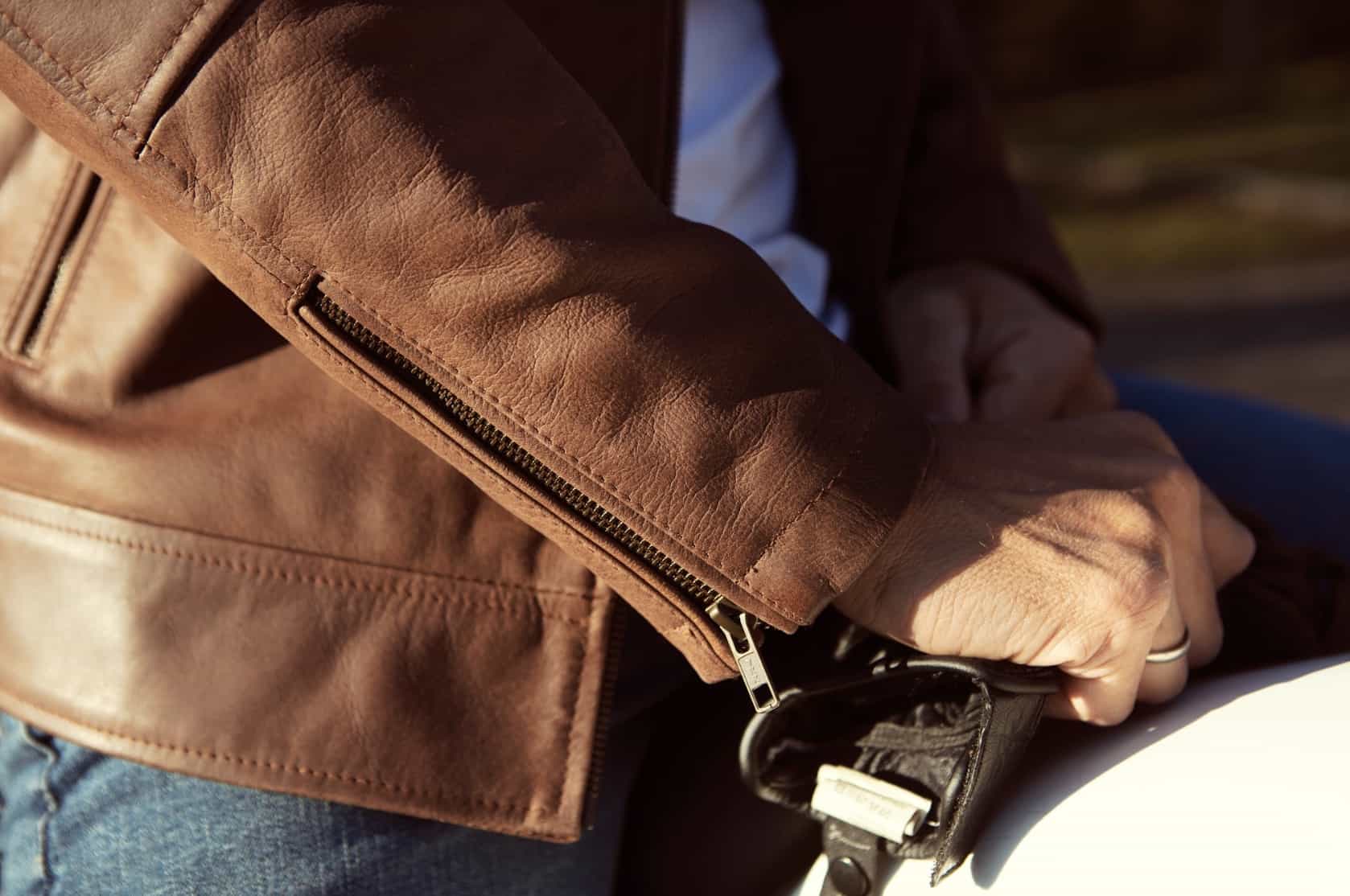close up of a brown leather jacket sleeve