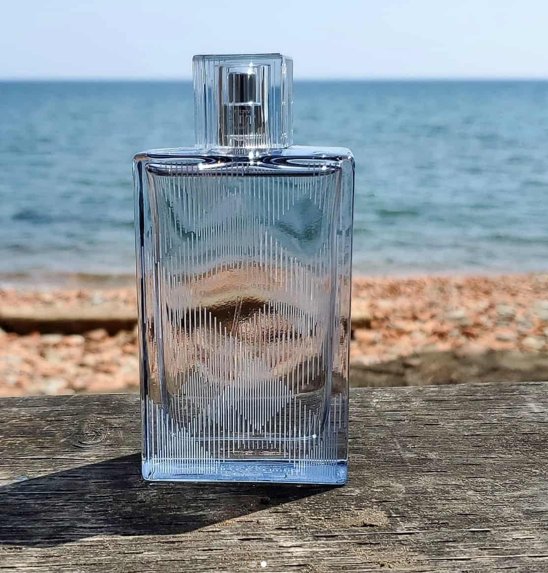Bottle of Burberry Cologne at a seashore