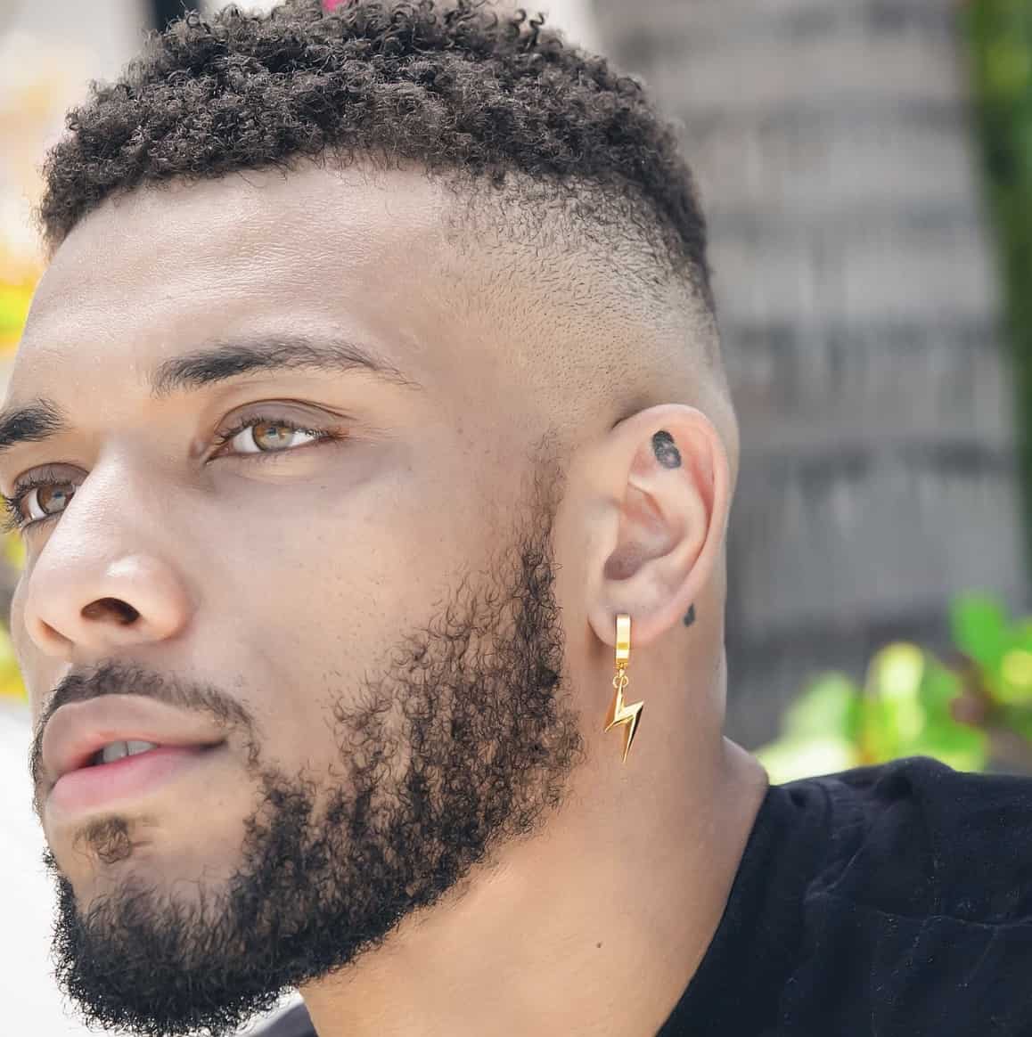 men's right lob piercing with a dangling lightning bolt