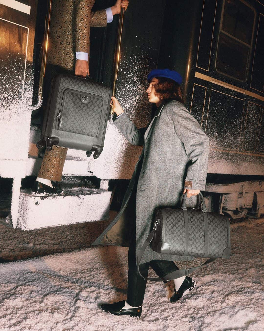 catching a train ride with a Gucci heritage-infused luggage