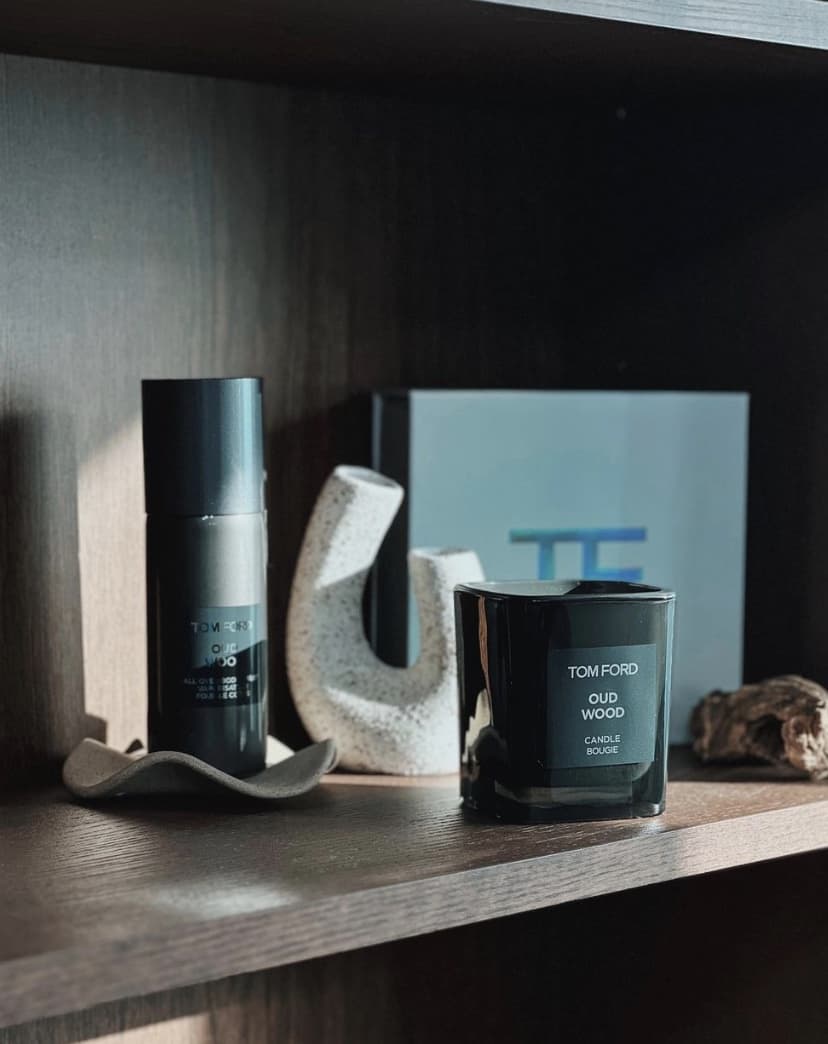 Tom Ford Cologne and candle on a shelf