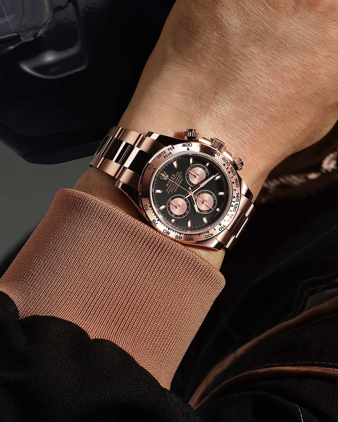 wearing a rolex oyster perpetual cosmograph watch