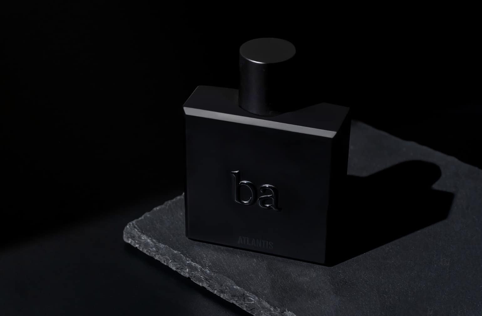 dark photo of a cologne bottle 